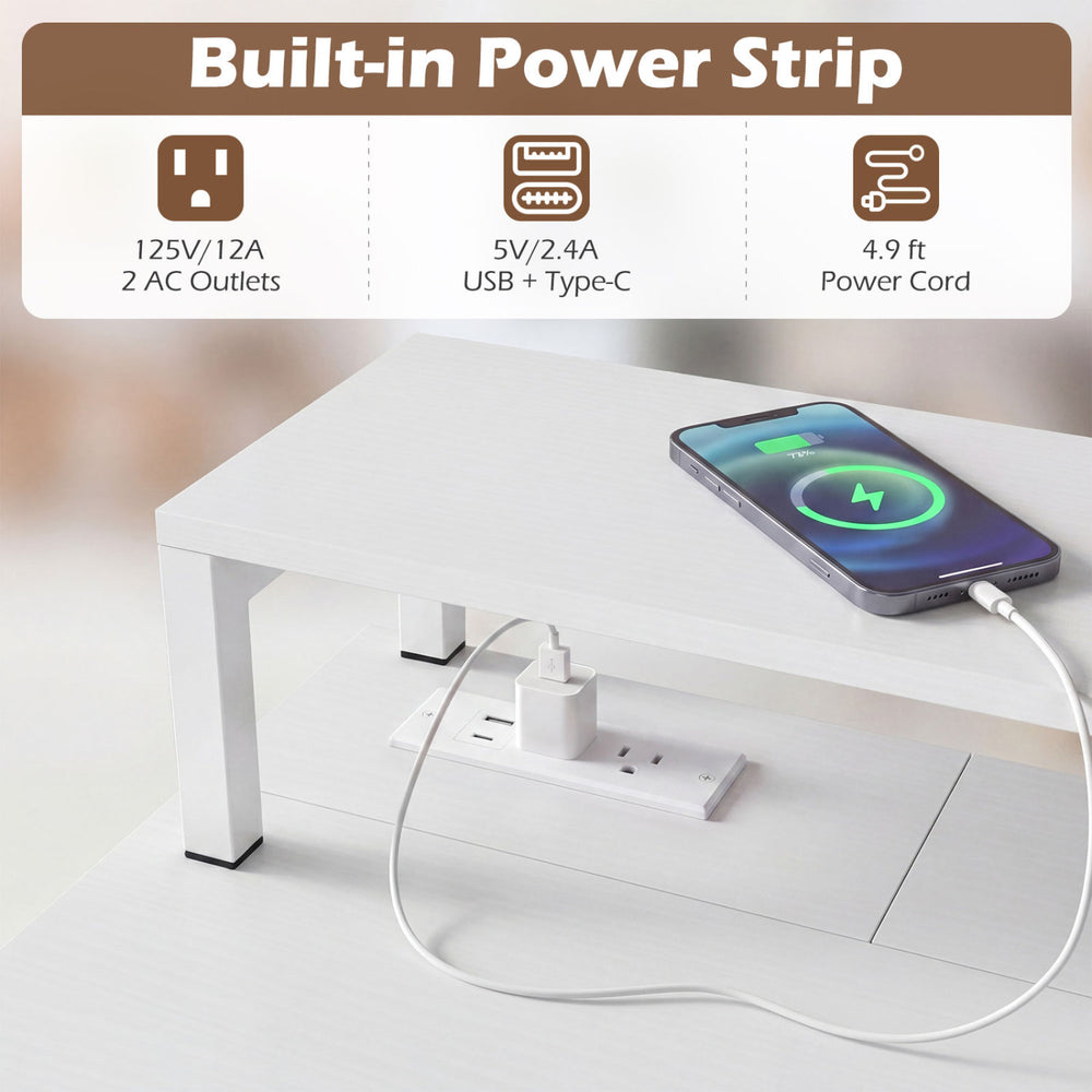 Compact office desk with built-in power strip, removable monitor shelf, and dual-use drawer for versatile functionality.