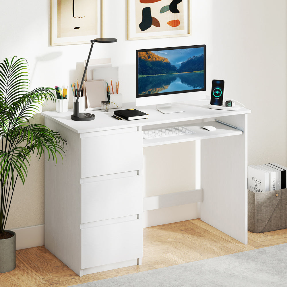 Computer desk in white with 3 large drawers, keyboard tray, and built-in power outlet for home office organization.