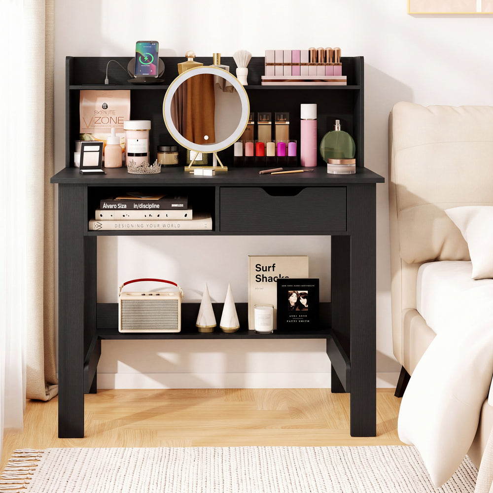 Computer desk in black featuring power outlets, USB ports, and a spacious hutch for organized workspace storage.
