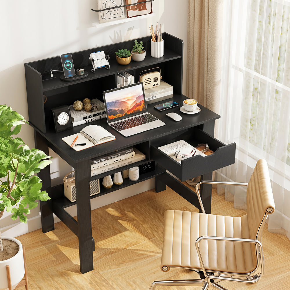 Computer desk in black with power outlets, USB ports, and a spacious hutch for organized workspace in modern interiors.