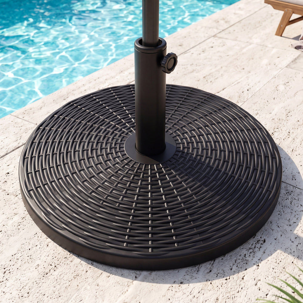 Concrete patio umbrella base with faux rattan pattern, designed for 8-9 ft umbrellas, featuring a stabilizer and.