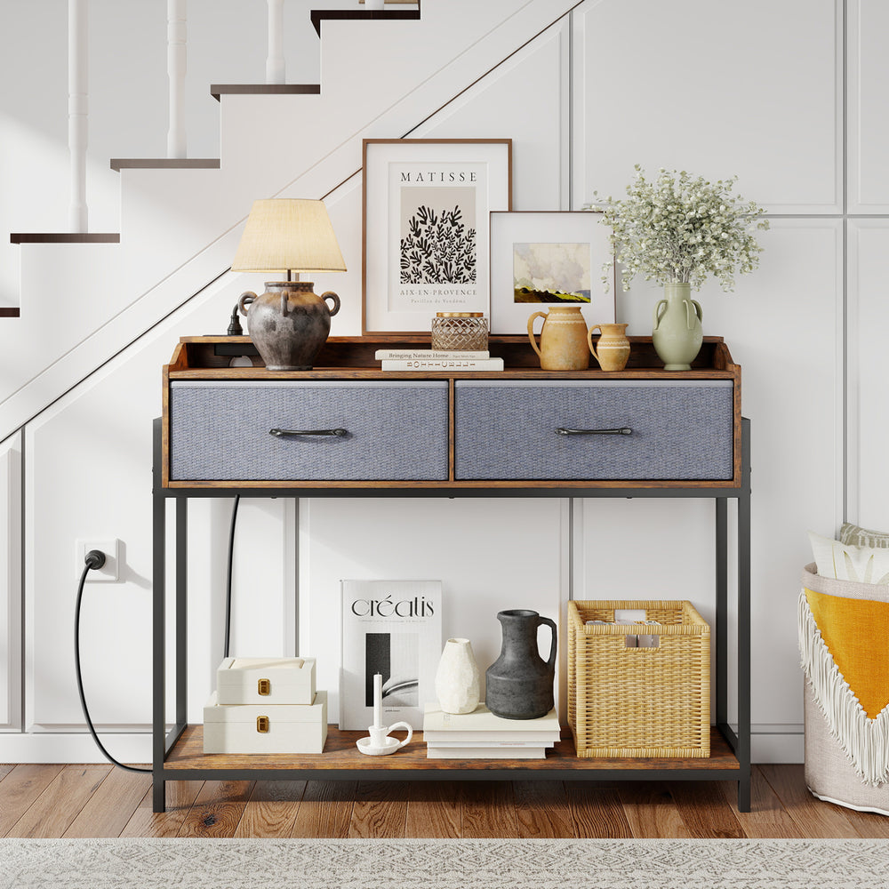 Rustic brown console table with charging station, featuring two drawers and shelves for organized storage in narrow spaces.