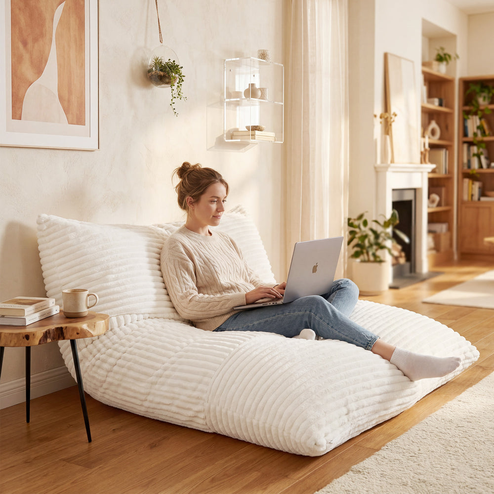 Convertible bean bag floor sofa in beige with a corduroy cover, perfect for reading or gaming in comfort.