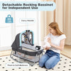 Detachable rocking bassinet in blue with carry handle, soft mattress, and safety features for newborns.