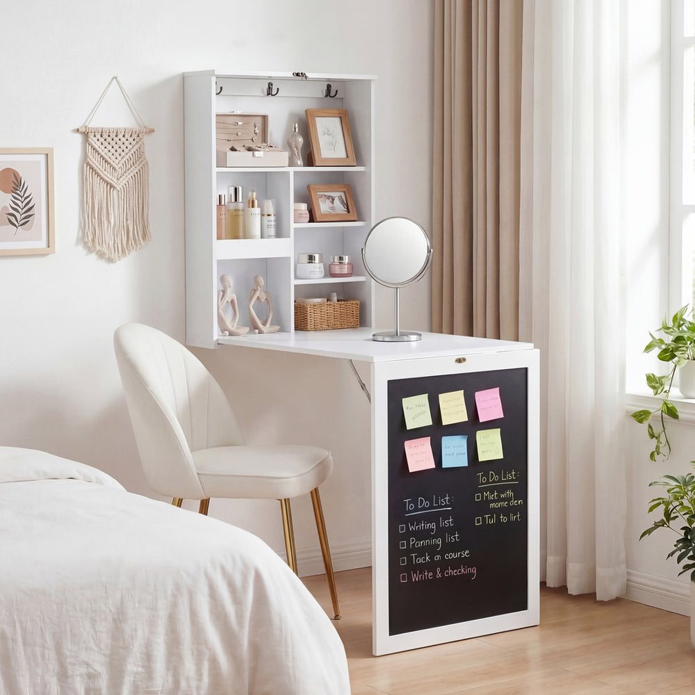 Convertible wall-mounted desk in white with chalkboard, featuring storage compartments and a smooth working surface.