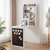 Convertible wall-mounted table in white with a chalkboard, providing a stylish, space-saving workspace and storage.
