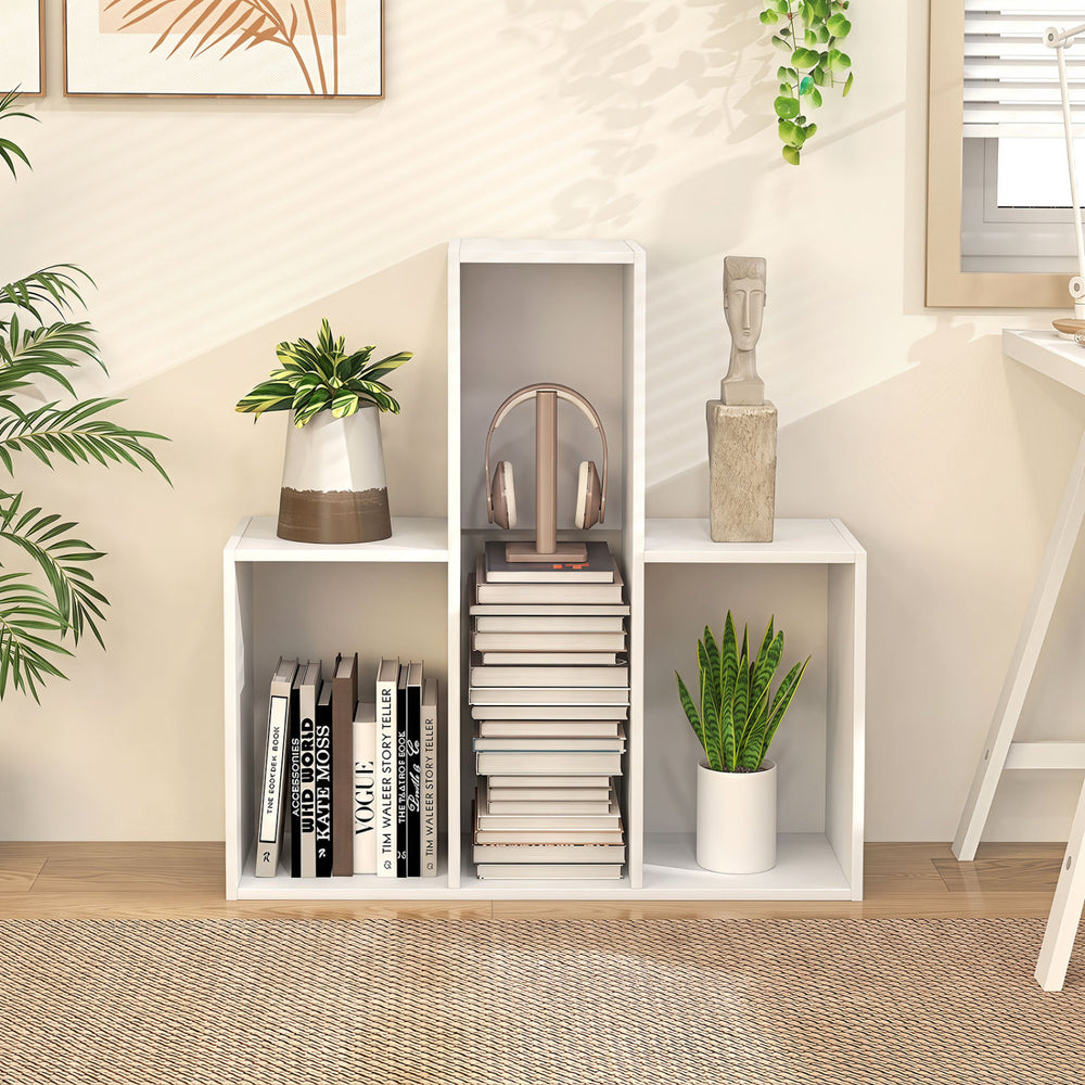 Convex bookshelf in white features three open shelves, anti-toppling devices, and a geometric design for versatile storage.