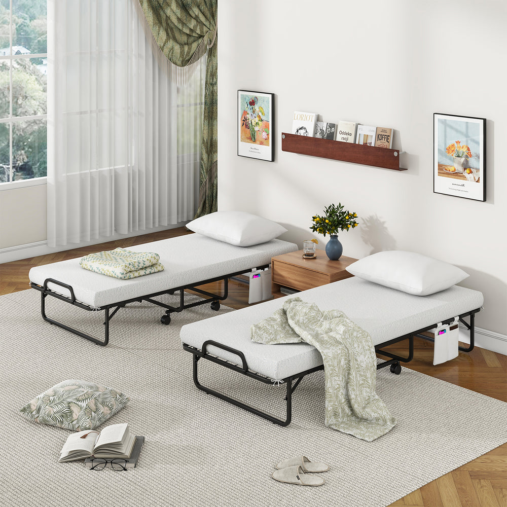 Folding cot bed with memory foam mattress and pillow, featuring a space-saving design and easy mobility for guests.