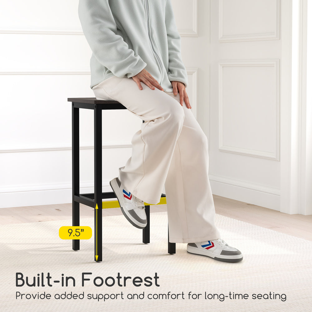 Counter-height bar stool with built-in footrest, gray, designed for comfort and stability in small dining spaces.