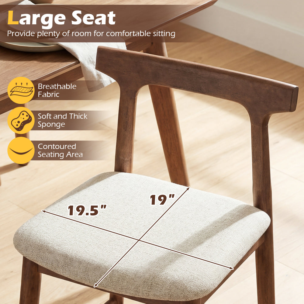 Counter height bar stool with a large 19.5" x 19" seat, curved backrest, and solid wood for kitchen island comfort.
