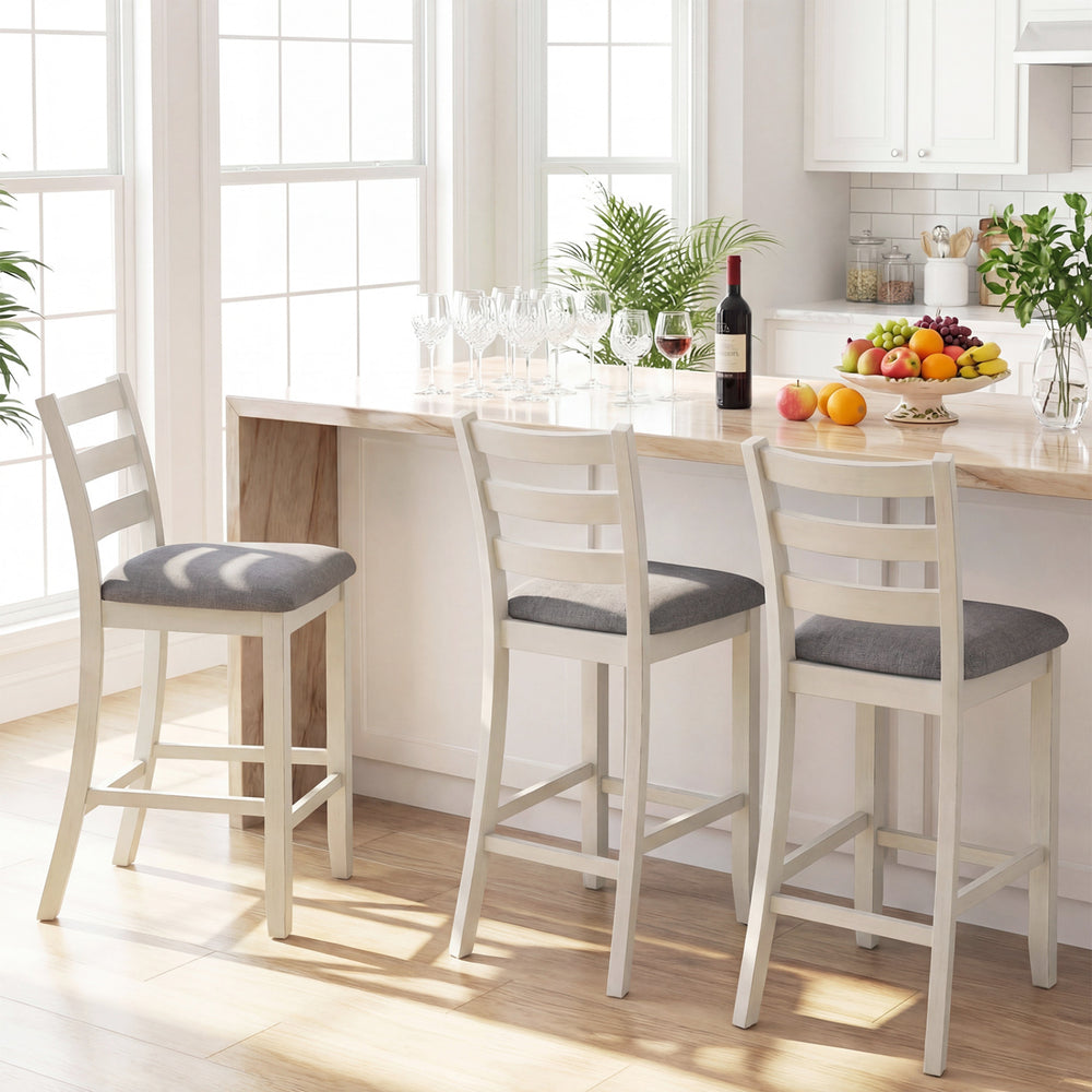 Counter height chairs with beige fabric seats and rubber wood legs, perfect for family meals and gatherings.