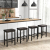 Set of four 24-inch brown bar stools with padded seats and rubber wood frames, ideal for kitchen counter seating.