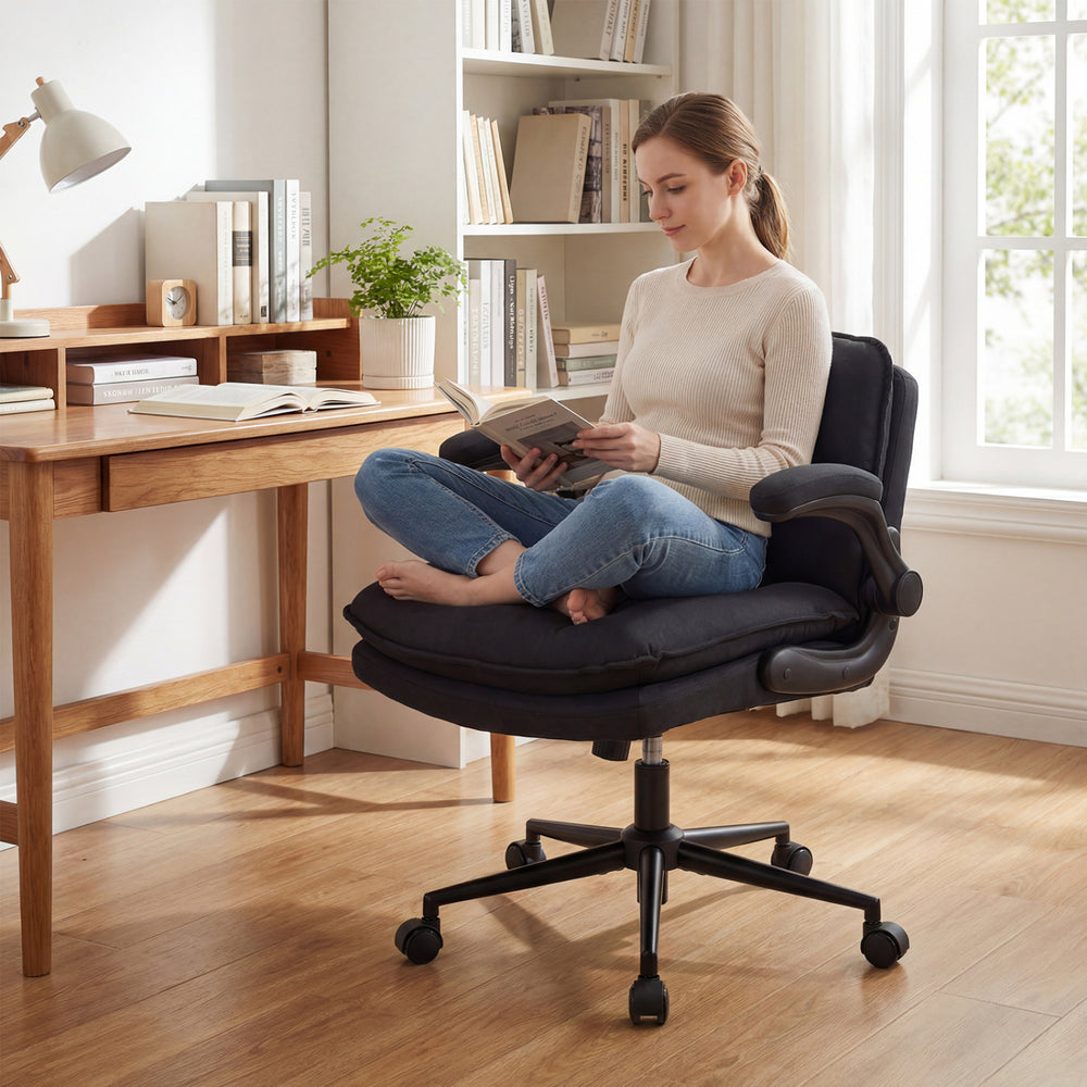 Criss Cross chair on wheels in gray with flip-up arms, featuring a padded seat and adjustable height for home office.