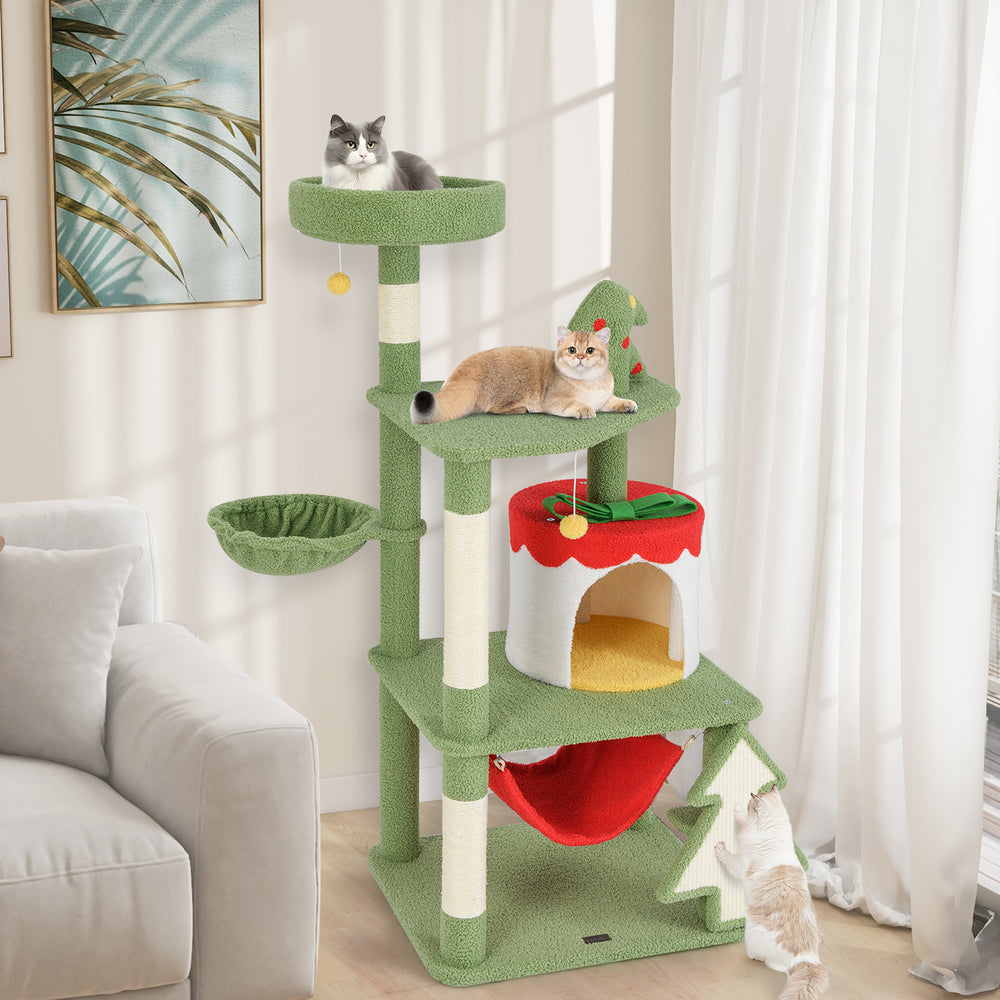 Cute Christmas cat tree in green with sisal scratching posts, gift box condo, and cozy hammock for feline fun.