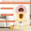 Whimsical monster-themed cat tower in pink and yellow with two condos and plush hanging toys for playful cats.