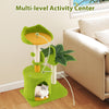 Multi-level cat tree in green with palm leaves, scratching posts, and cozy condo for indoor cats' play and rest.