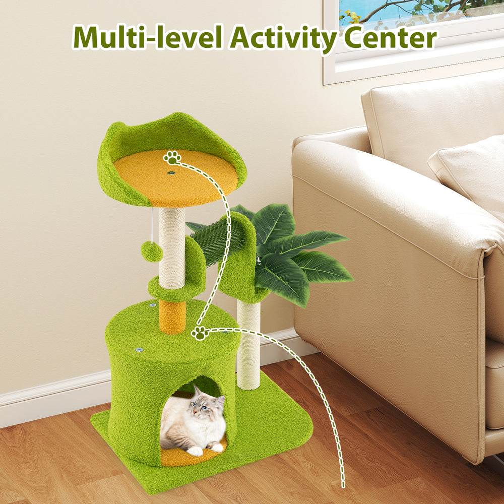 Multi-level cat tree in green with palm leaves, scratching posts, and cozy condo for indoor cats' play and rest.