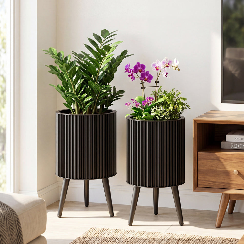 Set of 2 decorative flower pots with modern fluted design, drainage holes, and sturdy metal legs for versatile home decor.