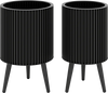Set of 2 modern black decorative flower pots with stands, featuring drainage holes and a fluted design for stylish decor.