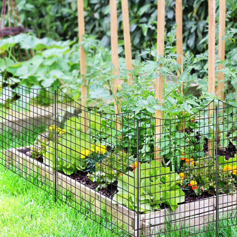 Decorative black garden fence with 5 panels and stakes, ideal for flower beds and keeping pets out of plants.