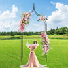 Decorative 9.5 feet metal garden arch with floral arrangements, perfect for weddings and outdoor parties.