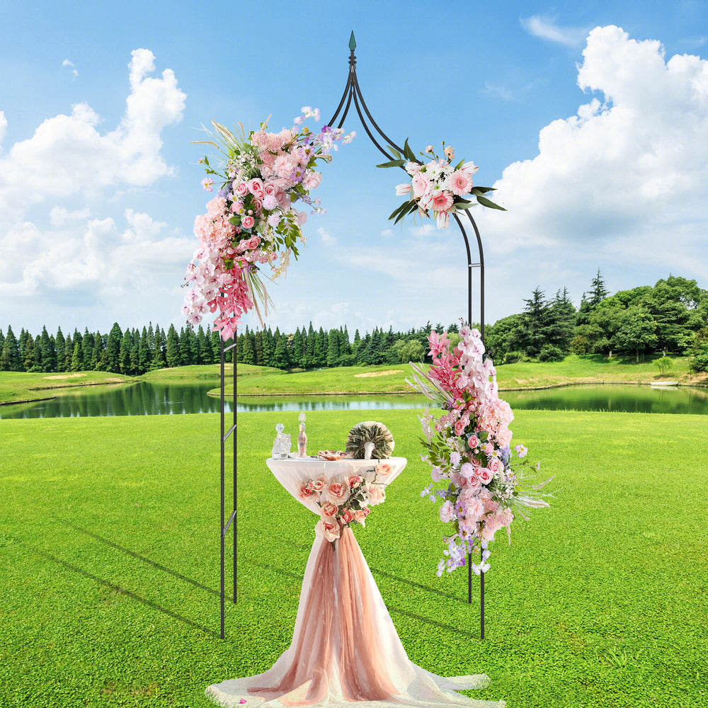 Decorative 9.5 feet metal garden arch with floral arrangements, perfect for weddings and outdoor parties.