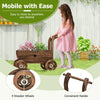 Decorative wooden wagon cart in rustic brown with wheels and handle, ideal for displaying potted plants in your garden.