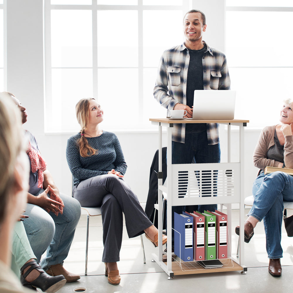 Height adjustable standing desk with bottom storage shelf, perfect for small spaces and presentations in an office.