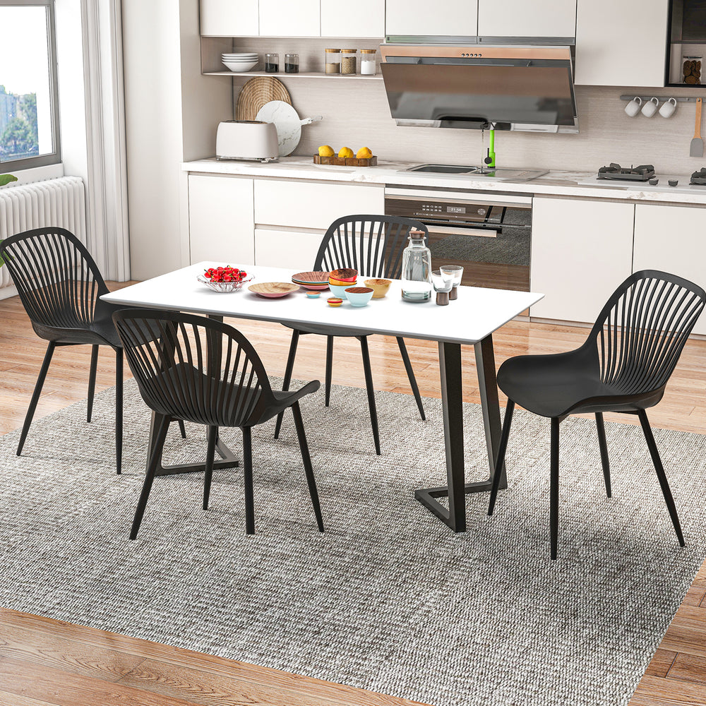 Black modern kitchen chairs with metal legs and cutout backrest, perfect for dining rooms and home offices.
