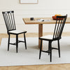 Two black farmhouse dining chairs with removable cushions, featuring solid rubber wood construction and ergonomic.
