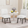 White fabric upholstered dining chairs with padded seats and rubber wood legs, perfect for kitchen or dining room.