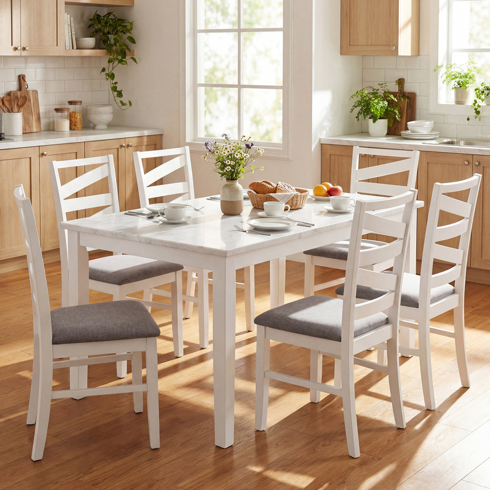 Set of four white dining chairs with backrests, rubber wood frames, and breathable linen upholstery for kitchen use.