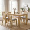 Set of 4 natural rubber wood dining chairs with fabric upholstery and spindle backrest, perfect for kitchen dining.