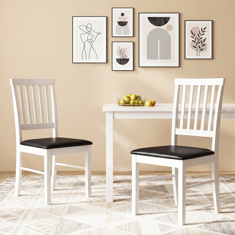 Set of 2 modern white dining chairs with black upholstered cushions, featuring ergonomic backrests for comfort.