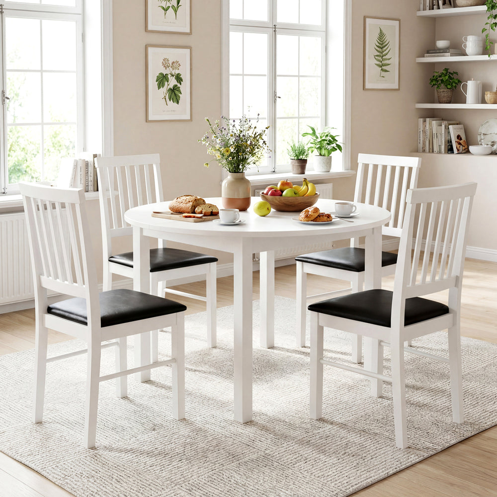 Set of two modern white dining chairs with black upholstered cushions, designed for comfort and durability in dining.