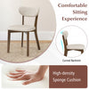 Dining chair with solid rubber wood frame and ergonomic backrest, featuring a high-density sponge cushion for comfort.