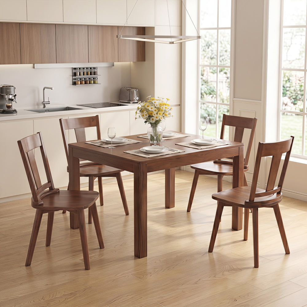 Set of 4 walnut dining chairs with ergonomic backrests and solid rubber wood frames, perfect for kitchen or dining room use.