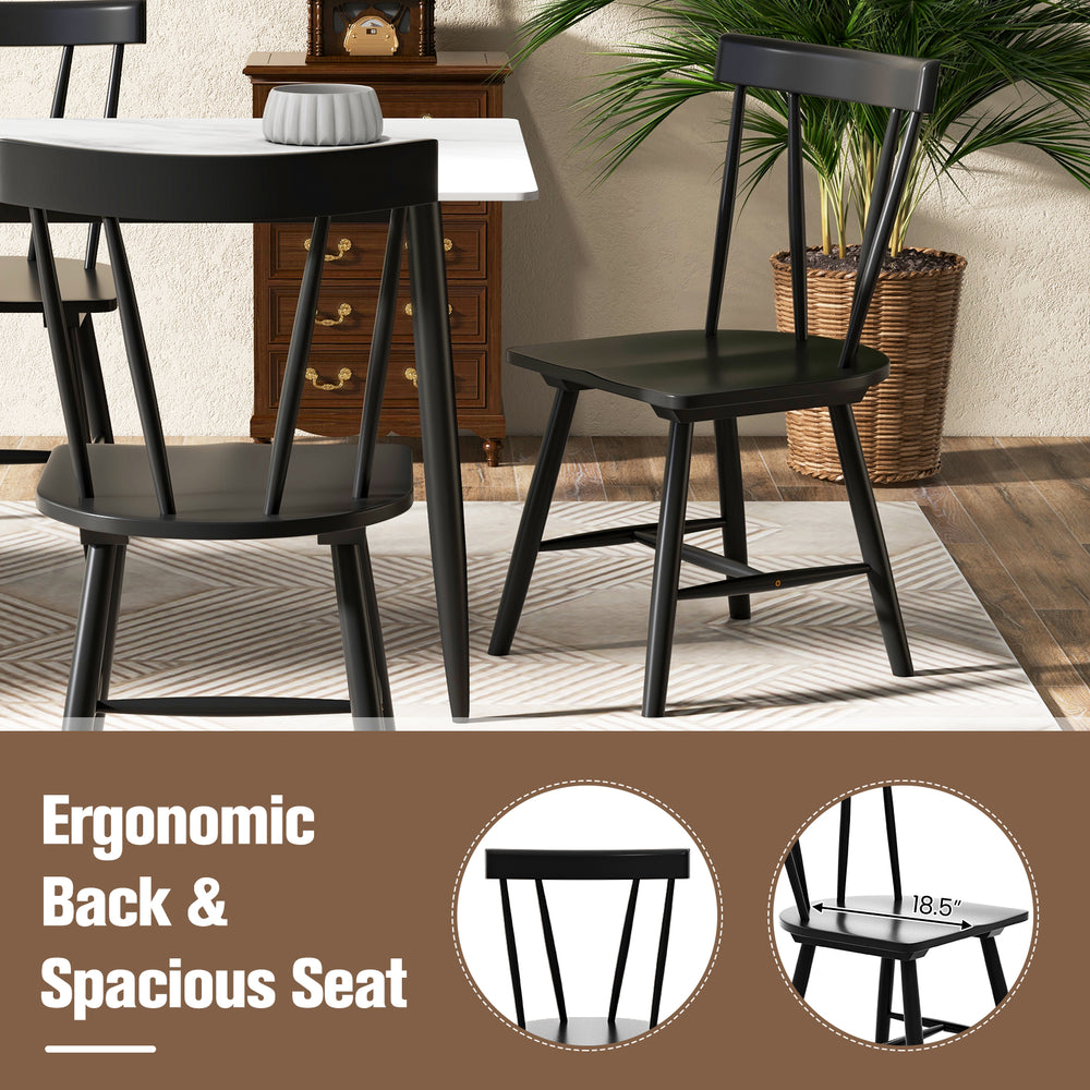 Windsor style armless chair in black with ergonomic back and spacious seat, perfect for dining or living room use.