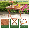 Patio dining table with slatted teak finish, X-shaped structure, and umbrella hole, perfect for outdoor relaxation.