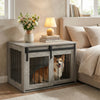 Dog crate furniture with sliding barn door in gray, ideal for small to medium dogs, serving as a stylish nightstand.