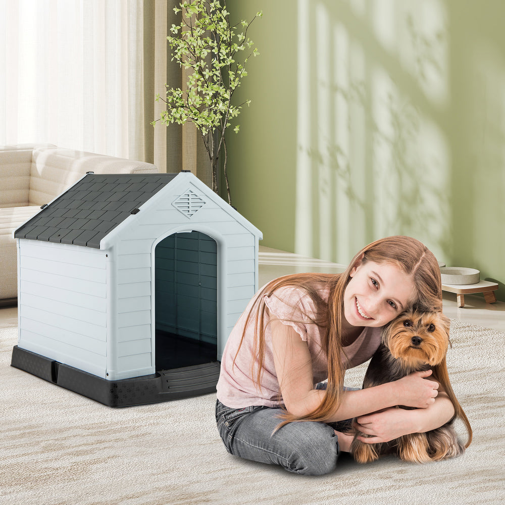 Small waterproof plastic dog house with elevated floor, featuring a removable roof for easy cleaning and durability.