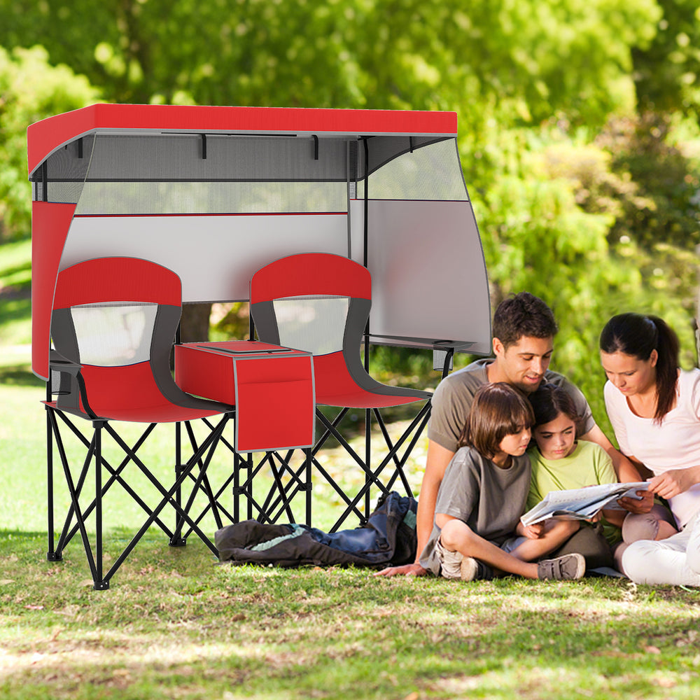 Double beach chair in red with adjustable canopy, side shades, and central cooler bag for outdoor relaxation.