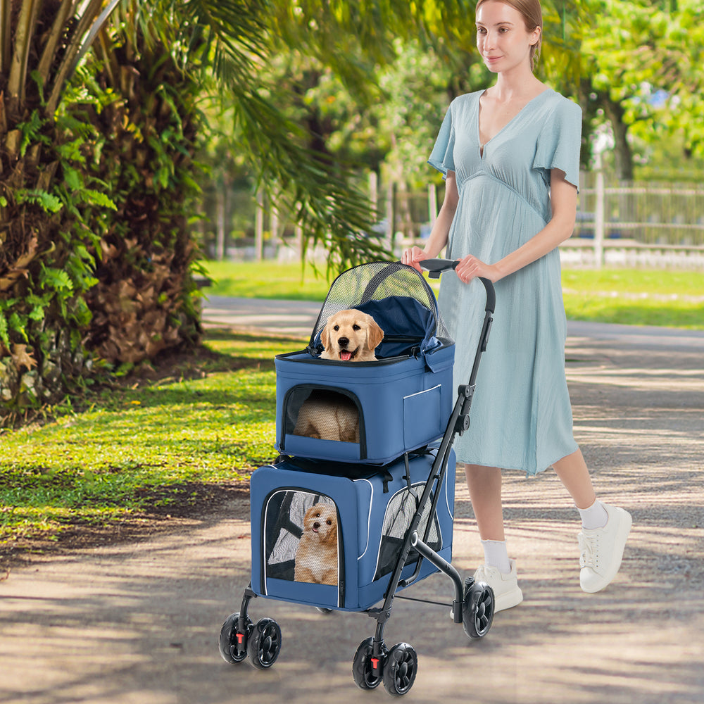 Double pet stroller in blue with detachable carriers, featuring breathable mesh and 360° rotatable wheels for easy.