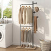 Double rods clothes hanging rack with rubber wood hooks, featuring a wooden shelf for shoes, ideal for laundry rooms.