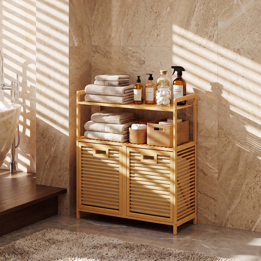 Natural bamboo double tilt-out laundry hamper with two baskets and two shelves for organized storage in any room.
