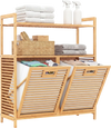 Double tilt-out laundry hamper in natural bamboo with two removable baskets and two open shelves for organized storage.