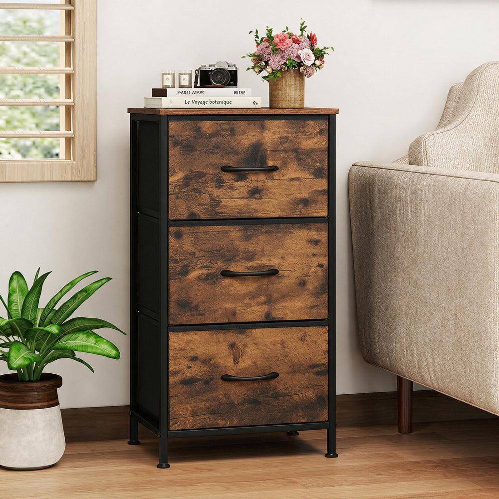 Dresser nightstand features three roomy fabric drawers with a sturdy metal frame, perfect for bedroom storage solutions.