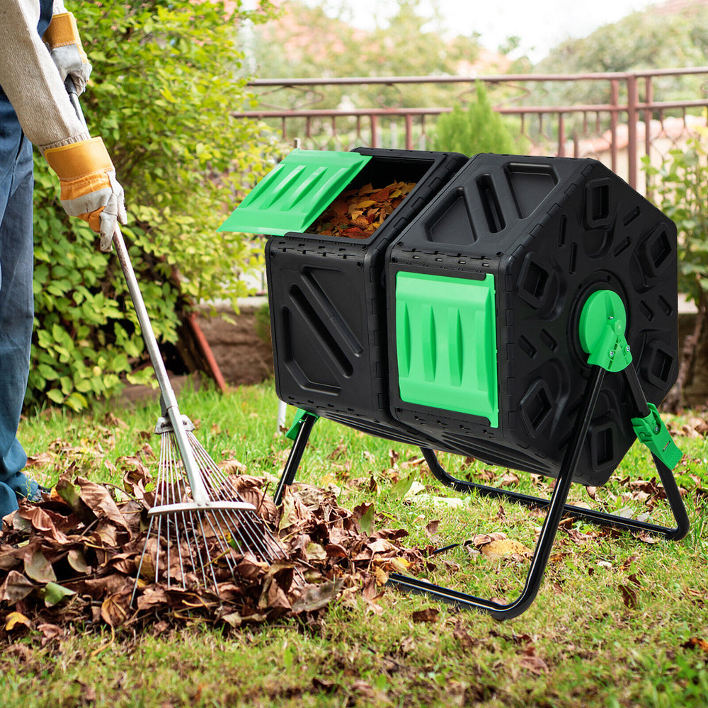 Dual chamber garden compost tumbler in black and green, designed for efficient composting with sliding doors and a.