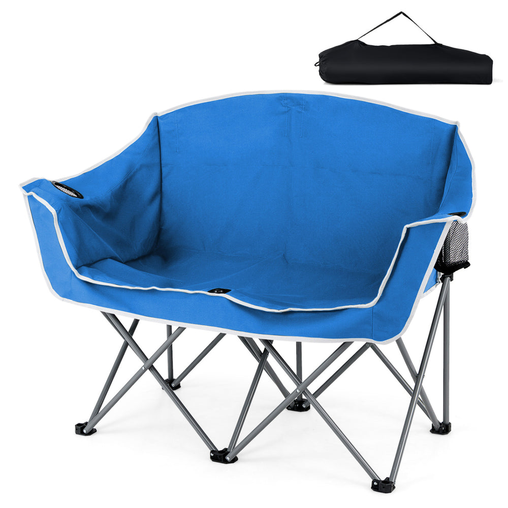 Portable oversized loveseat camping chair in blue with armrests and cup holders, ideal for outdoor relaxation.