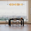 Compact dining set with a large table, six folding chairs, and a rolling cart for efficient storage in modern living.